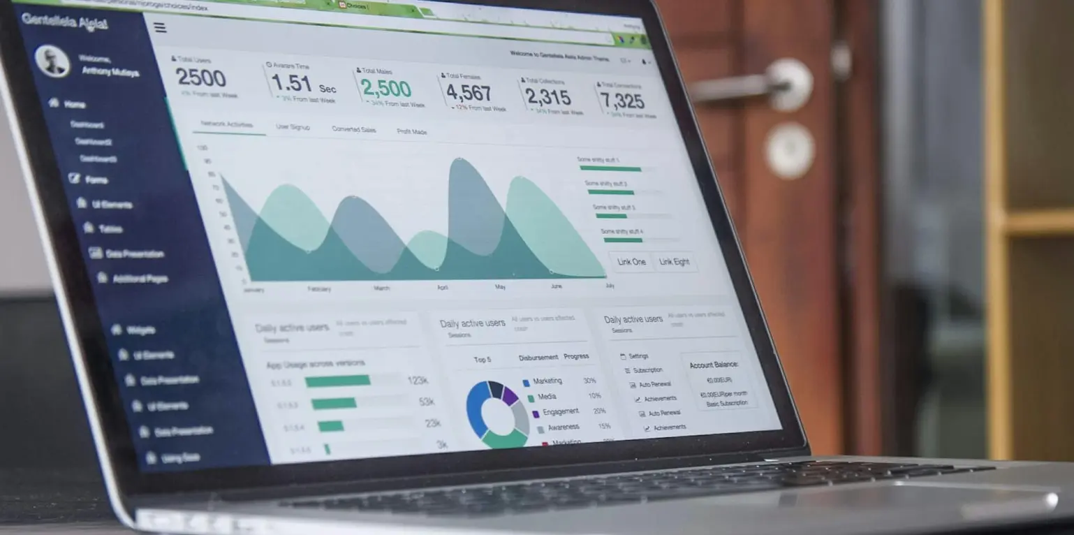 laptop computer on glass-top table